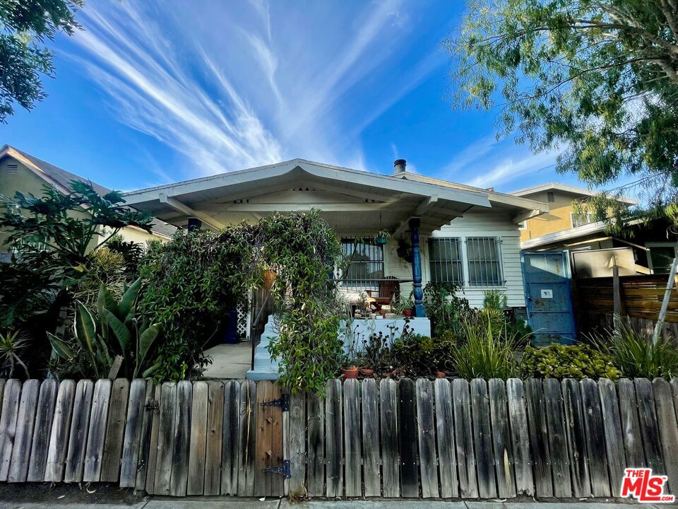 A rare and exciting opportunity to own a 50% Tenant-In-Common (TIC) interest in a charming Venice triplex, located just blocks from Abbot Kinney, the beach, and the iconic canals. This offering includes exclusive use of a spacious 1400 SQFT 2-bedroom, 2-bath unit (#3), full of Venice charm with hardwood floors, an updated kitchen, fireplace and abundant natural light. In addition, the buyer will receive 50% ownership interest in the detached front bungalow, creating potential for shared income, flexible use, or future value. Each unit enjoys a private garage with storage plus one additional assigned parking space in a secured lot, a rare luxury in Venice. With no HOA dues, this is an ideal alternative to a condo, offering the benefits of ownership at a more accessible price point in one of LA's most vibrant neighborhoods. This is a TIC sale for a 50% undivided interest in the entire property, with exclusive rights to one unit and shared ownership in the front bungalow.