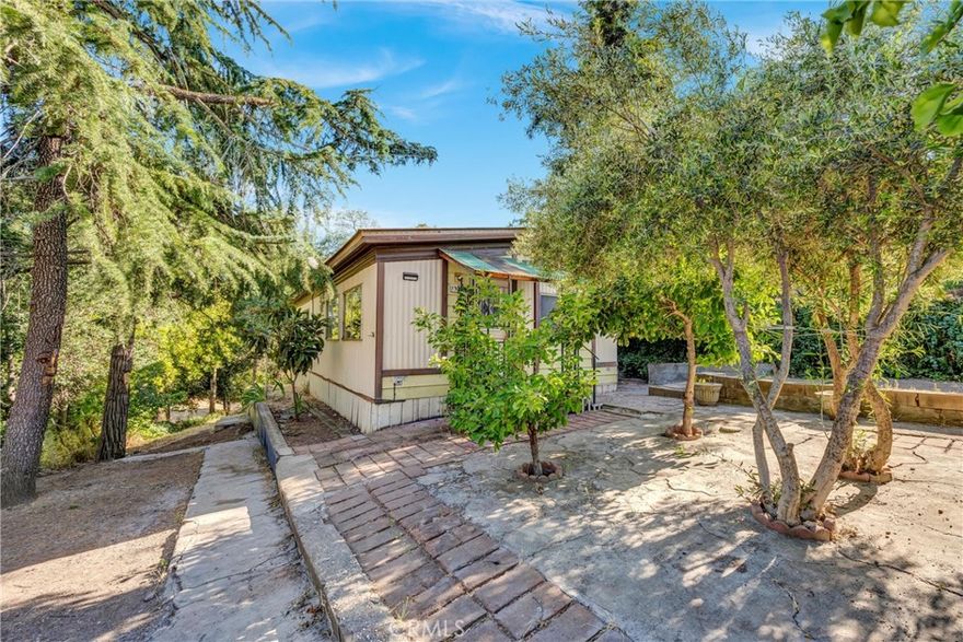 Welcome to this newly renovated 2-bedroom, 1-bathroom manufactured home situated on a nice lot with a peaceful and private setting. Inside, the home features fresh paint and new carpet, creating a clean and inviting atmosphere throughout. The lot offers plenty of room to enjoy the outdoors, with ample shade and a relaxing outdoor space perfect for entertaining or unwinding. There’s also extra parking on the side, providing convenience guests, recreational vehicles, or additional storage. If you’re looking for a move in ready affordable home with a comfortable layout and a serene setting, this property is a must-see. Come take a look!