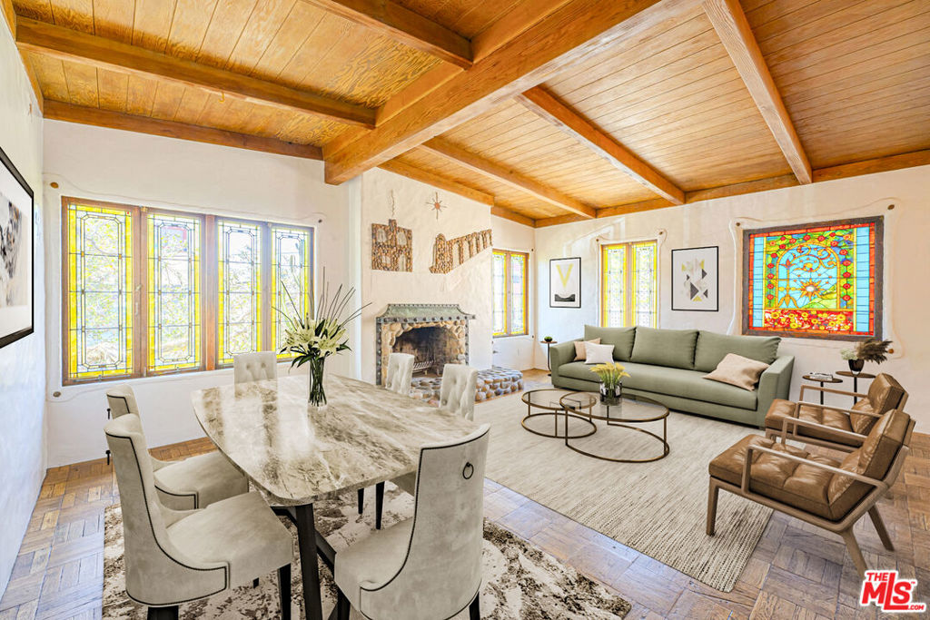 Sprawling 3-bedroom, 2-bath home exuding original Boho charm! Situated on the top floor, just one flight up, this residence offers spacious bedrooms and bathrooms enhanced by unique stained glass accents and vintage tile. The living area features a decorative fireplace and hardwood floors, along with stunning details throughout. Enjoy the convenience of in-unit laundry in the primary bedroom and an assigned parking spot. Nestled in an unbelievable location near the beach, Marina, Venice, and adjacent to a community garden. Utilities included: water, sewer, and trash. Tenant is responsible for electric, gas, renters insurance, cable/internet. Pets are welcome upon approval.