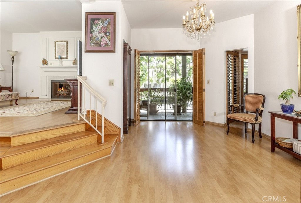 Welcome to this expansive and beautifully maintained 2-bedroom, 2-bathroom front-unit condo with a bonus den or home office, located in one of Northwest Glendale’s most desirable neighborhoods. Offering approximately 1,761 square feet of thoughtfully designed living space, this rare offering blends spaciousness, comfort, and a layout that lives like a single-family home.
The single level condominium floor plan creates a dynamic flow throughout the unit. A grand elevated living room is highlighted by wood-style flooring, a fireplace that anchors the space, and large windows that frame calming views of Valley View Road and the lush North Glendale hills. Just a few steps above, the formal dining area and oversized kitchen offer generous functionality, complete with a breakfast nook, ample cabinetry, and tile flooring—ideal for daily use or entertaining.
The private primary suite is set apart on its own level, adding to the sense of retreat and privacy. This suite includes a spacious closet, large vanity, and direct access to the bathroom. The secondary bedroom and versatile den offer flexibility for guests, hobbies, or remote work. The in-unit laundry area, abundant closets, and sliding doors leading to a private patio add even more convenience to this already impressive space.
The well-kept community features a serene pool and spa area, offering a peaceful escape without ever leaving home. All this is set just minutes from The Americana at Brand, Glendale Galleria, local parks, dining destinations, and with quick access to major freeways. A rare and elegant lifestyle opportunity in a premier Glendale location.