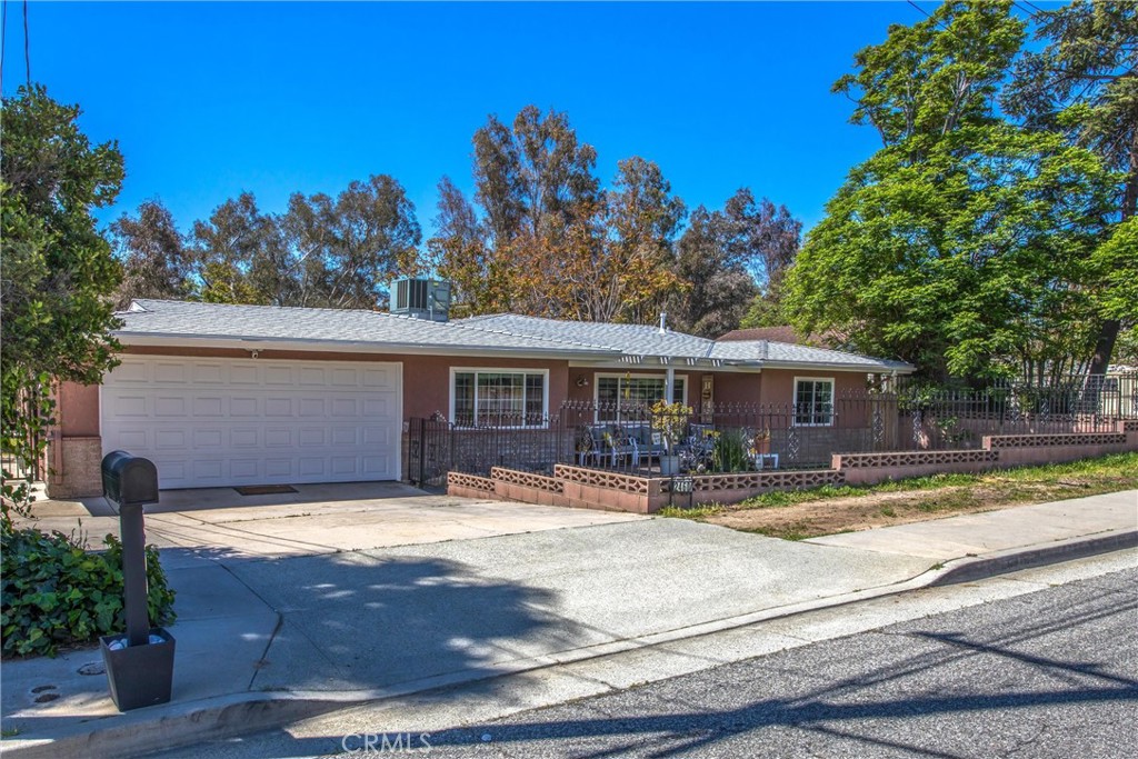 Welcome to this fully remodeled single-story home that perfectly blends comfort, style, and functionality—ideal for multi-generational living, entertaining, or simply relaxing in your own private retreat. Situated on a spacious lot in a desirable neighborhood, this home features a versatile layout with a separate guest/in-law suite at the back of the house. Whether used as a one-bedroom apartment, pool house, or private quarters, this flexible space adds tremendous value and convenience. The freshly painted exterior and brand-new energy efficient roof offer great curb appeal, while inside, you’ll find a light-filled interior with new neutral paint and high-end vinyl plank flooring throughout. The remodeled kitchen is a true highlight, featuring an oversized deep-dish sink, sleek new appliances, ample storage, updated cabinetry, new counters, and a stylish backsplash. The adjoining dining area and open family room create an inviting space to gather and unwind. Both bathrooms have been beautifully renovated with modern vanities, fixtures, and mirrors, giving them a luxurious, spa-like feel. The spacious bedrooms are filled with natural light, enhancing the home’s airy and welcoming atmosphere. Additional features include: A spacious garage with extra storage, Room in the driveway for a small RV or boat, Newer dual-paned windows that are energy efficient, sound resistant, and with a 16-year warranty, No HOA or Mello-Roos tax. Step outside into your private backyard oasis—an entertainer’s dream with a large pool and a tranquil fountain pond. Conveniently located near top rated schools, shopping, and entertainment, this home offers the perfect balance of elegance, practicality, and lifestyle. Don’t miss your chance to own this stunning, move-in-ready gem. Schedule your private tour today!