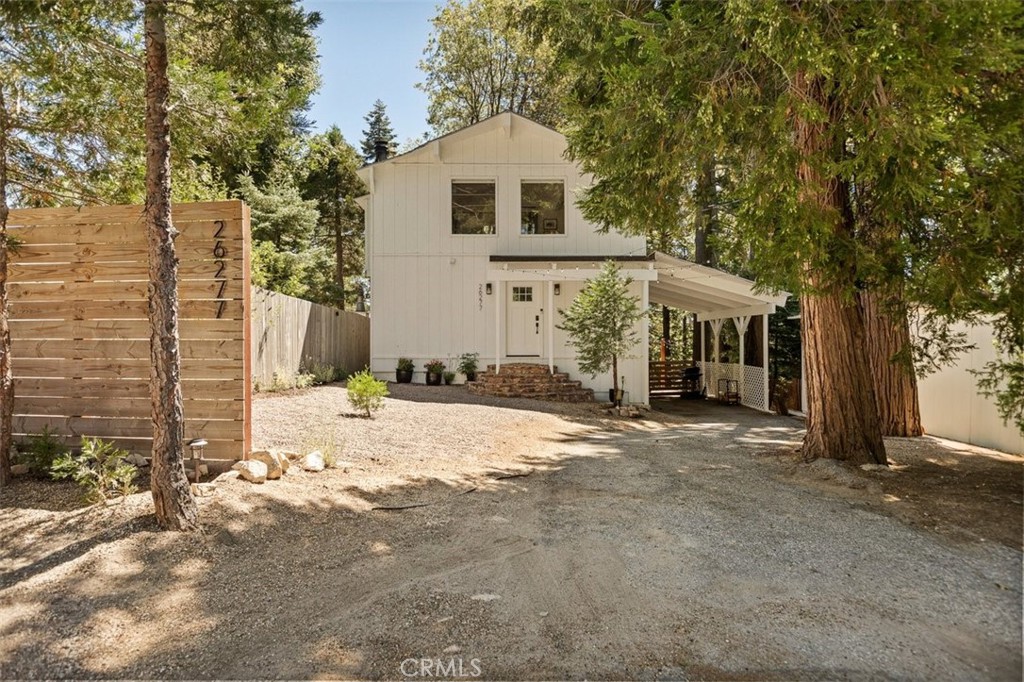 Tucked in a quiet Twin Peaks neighborhood, this updated 2-bedroom, 1-bath mountain cottage blends modern comfort with vintage charm on a generous 9,000 sq ft mostly flat lot—complete with rare off-street parking for up to five cars. The freshly painted exterior and interior in soft cottage white set the tone, while a newly framed white wood ceiling adds warmth and character to the open main living space. Enjoy a beautifully remodeled kitchen with vintage-style appliances, refinished original wood flooring upstairs, new flooring downstairs, and a cozy wood-burning fireplace ready for crisp evenings. The upgraded bathroom includes new plumbing and electrical with new artisan tile in the shower. The rest of the house has additional upgrades which include a new electrical panel, remote-controlled blinds, ceiling fans, and a mini split A/C system for year-round comfort. Step outside to a brand-new balcony off the bedroom, a fully fenced backyard, a spacious storage shed, and room to expand—ideal for guests or potential rental income. Located just minutes from both Lake Arrowhead and Lake Gregory with fast access to Hwy 18 (a priority snow-plow route), this turnkey home is perfect for weekend getaways, remote work escapes, or full-time mountain living. Stylish, cozy, and full of opportunity—this one won’t last.