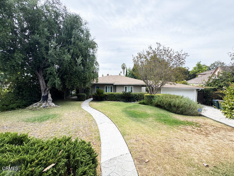 This contemporary, spacious 3 bedroom, 2 bathroom home on a large lot is located in one of the best neighborhoods in Pasadena. Convenient to Lacy Park, the Langham Hotel, Lake Avenue Shopping, San Marino, and South Pasadena, this updated house sits back from the street with a generous front yard and has all the modern amenities and a great layout. All the bedrooms, along with the family room, face the enormous landscaped backyard. The oversized primary suite, with beautiful tree top views, has two walk-in closets, and plentiful, additional built-in storage. Two additional bedrooms are nicely sized and also have lovely views into the lush backyard. All three bedrooms enjoy luxurious privacy and lots of natural light. The eat-in kitchen has easy access to the garage and backyard, and the large laundry room with sink makes doing chores a breeze. In addition to the main house, there are two bonus storage basement rooms. A two-car garage with built-in storage and a large driveway make it easy to park 3 or more cars on the property. Electric Tesla car charger is already installed and ready to use (but will not be maintained).