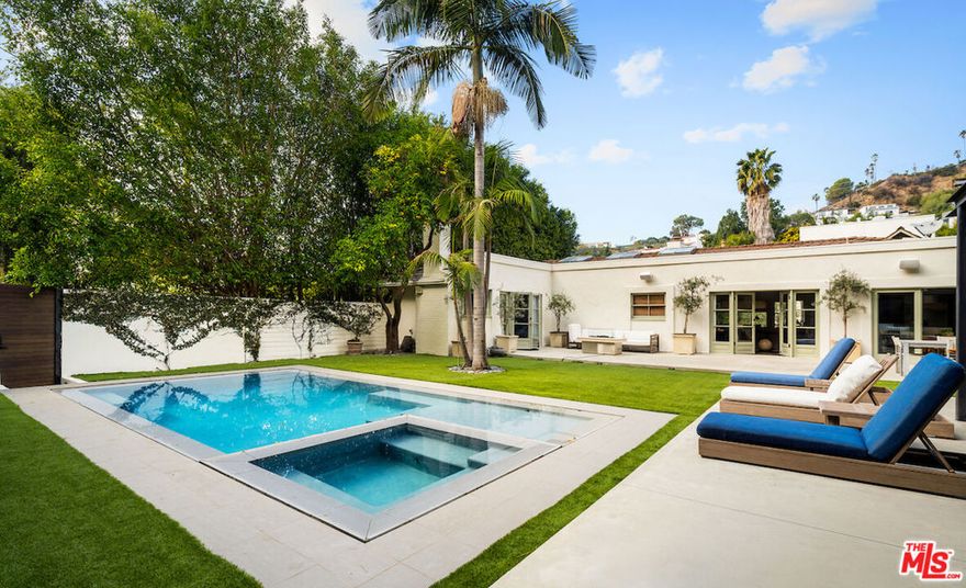 Privately tucked away behind gates and mature landscaping in one of the best locations in the Bird Streets is this stunning residence. Done to the nines; an open concept formal living room seamlessly adjoins the chef's kitchen. Muted green cabinetry is the perfect compliment to the stone waterfall island, stainless steel appliances, and hardwood floors. Raised ceilings with skylights welcome in an abundance of natural lighting in addition to the sliding doors that finely blend indoor-outdoor living. The luxurious primary suite offers dual sinks, soaker tub, and a shower with a built-in sauna. Two additional bedrooms complete this functional floor plan. All of this 8,100+ SqFt lot has been meticulously transformed into an entertainer's oasis. An outdoor grill and dining area are ideal for enjoying a meal al fresco in addition to the wet bar, wine fridge, outdoor tv and heaters in the covered cabana. Enjoy the California sun lounging on the flat grassy pad and swimming in the generous pool and spa. Additional features include a pool house with one bedroom and one bathroom, an oversized, grass paved, motor court and two care garage.