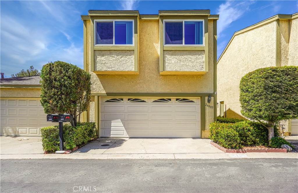 This Attached Single Family Home is located on a cul-de-sac within the Aegean Heights Community. First floor boasts an open living room and dining room floor plan with vaulted ceilings. The kitchen has stainless steel appliances with much counter space. A separate family room has a cozy fireplace and wet bar with sliding doors that exit to the front private gated patio. As you proceed upstairs, you will find the Primary Bedroom with en suite bathroom, a 2nd bedroom and a full hall bathroom. A very popular feature of the "Bridgeview" floorplan is a separate Bonus Room (about 440 sq ft) accessed by the upper story breezeway. This room can be used for a variety of things ... a 3rd large bedroom, a large home office, a home theater, studio, gym, and much, much more. Enjoy the cozy back yard with no one behind you. Laundry hookups are in the two car attached garage. The home is located very close to the Aegean Heights Clubhouse, pool, spa, tennis courts, and picnic area. Photos from 2022.