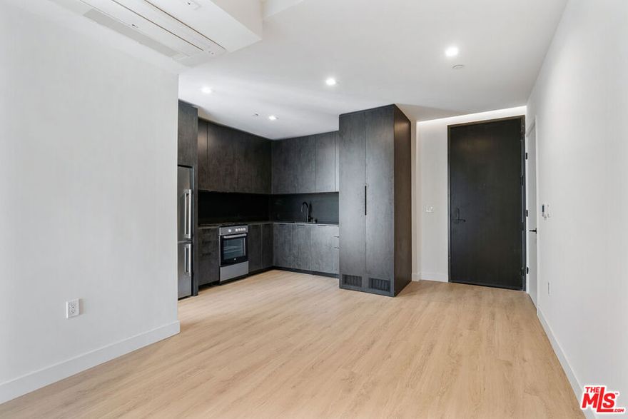 Venue Residences by Helio. This 1 bed + 1 bath is West facing with lots of light and open views. Kitchen has unique dark finishes with stained granite counters, matte black fixtures, and stainless steel Beko appliances including fridge, dishwasher, and gas stove. The bedroom has a large balcony, built in lighting, ceiling fan, electronic blackout curtains, and a walk-in closet. The bathroom has a wall-to-wall mirror, under sink storage, and a shower/tub. Property amenities include: Fitness center with Technogym equipment, 2 rooftop lounges, heated dipping pool, outdoor cooking area, co-working spaces, and front desk staff. Parking is $150/month for a single space, and internet $84/month. Tours are available by appointment, so please contact us today.