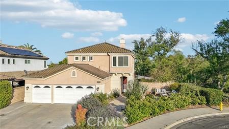 LOCATION, PRIVACY, SPACE Stunning North Chino Hills Home at Premium Cul-de-Sac Location offering scenic views, privacy and lots of indoor and outdoor space. Welcome to your turnkey dream home nestled in one of North Chino Hills' most sought-after neighborhoods! Perfectly positioned on a premium cul-de-sac lot with breathtaking greenbelt and rolling hill views, this beautifully upgraded residence offers the ideal blend of luxury, comfort, and convenience. Step inside to discover a bright and airy interior featuring rich wood flooring, abundant natural light, and a seamless open-concept layout. The formal living and dining areas provide an elegant space for entertaining, while the gourmet dine-in kitchen is complete with crisp white cabinetry, designer tile backsplash, a spacious center island, and top-of-the-line stainless steel Samsung appliances. The kitchen flows effortlessly into the inviting family room, anchored by a dual-sided fireplace and custom entertainment niche—perfect for cozy nights in or lively gatherings. This thoughtfully designed home includes a first-floor bedroom and full bath, ideal for guests or multi-generational living, along with a convenient laundry room. Upstairs, the expansive primary suite is a true retreat, featuring a private balcony with panoramic views, a spa-inspired ensuite bathroom with dual vanities, and a custom walk-in shower. Two additional upstairs bedrooms share a beautifully remodeled full bath, offering plenty of space for family or a home office setup. Step outside to your own private oasis—both the front and backyard have been professionally landscaped with pavers, raised flower beds, and custom lighting. The covered patio, surrounded by lush greenery and mature fruit trees, provides ultimate privacy and creates the perfect setting for outdoor dining and entertaining. Additional upgrades include: Newly remodeled bathrooms with premium materials and fixtures Upgraded double-pane windows for energy efficiency Newer HVAC system, water heater, and water conditioner Ample parking for multiple vehicles Located within the prestigious California Blue Ribbon Distinguished School District, and just minutes from major freeways, shopping, and dining—this home truly has it all. Don’t miss your chance to own this rare gem in North Chino Hills—schedule your private tour today!