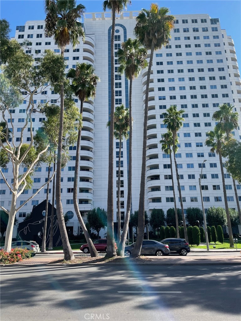 Beautiful updated One Bedroom Condominium. Spacious open floor plan with laminate flooring throughout. Gourmet kitchen features white engineered counter tops with decorative tiled back splash. Never LG Appliances, updated cabinets, oversized stainless steel sink, marble flooring and breakfast counter bar overlooking the living room/ dining area. Picturesque balcony with sliding glass doors is accessible to both the Living Room and Dining Room locations. Main Bedroom includes viewing windows with blackout shades and ample CA. Closet enhanced with built-in drawers and shelves. Remodeled Bathroom is highlighted with an oval shaped bathtub/ shower encompassing glass shower doors and marble surrounds, newer vanity with drawers and two medicine cabinets. Separate Laundry Room contains a stacked washer/ dryer, built-in cabinets, hanging rod, and counter space. Additional notable items include A.C., plenty of storage, 2 tandem parking spaces, guest parking, 24 hour Security Guard, pool, outdoor jacuzzi, gym, and common area reception area. The perfect place to come home to.