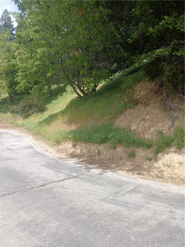 Wide 89 foot street frontage vacant land lot on the upside. Ready to build with utilities nearby and in the street.
