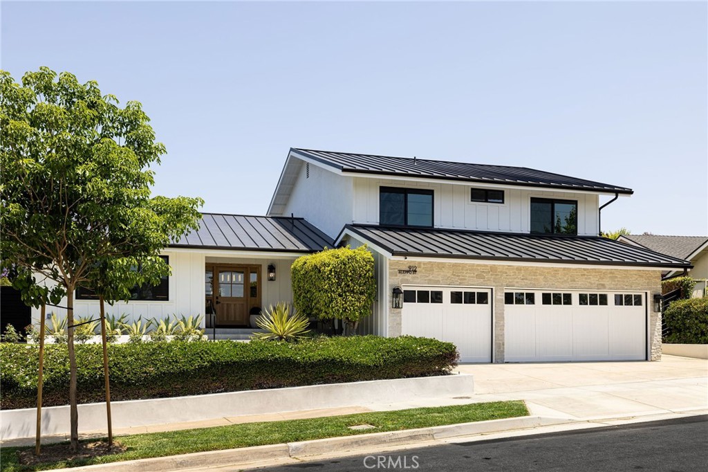 Welcome to your dream home in one of Newport Beach’s most sought-after neighborhoods, nestled on a quiet Cul-de-Sac. This exquisite residence has been completely remodeled inside out with no detail overlooked. Step inside the custom Dutch door to discover an open floor plan bathed in natural light with brand-new hardwood flooring, custom white oak cabinetry, designer lighting and high-end fixtures throughout. The vaulted ceiling with exposed wood beam creates a warm and welcoming ambiance. The living room and family room feature 2 modern textured limestone fireplaces to enjoy cozy evenings. The first floor features indoor laundry, a bedroom and full bath perfect for an office or multi-generational living. The gourmet kitchen is a true showstopper—featuring Subzero wine and refrigerator, Thermador range, built-in microwave and elegant plaster hood. The massive island is a stunning focal point with Taj Mahal Quartzite countertop creating a great place for gathering with friends and family. The primary suite offers a peaceful retreat, completed with a spa-like bathroom boasting a 72” freestanding tub, Carrara fluted marble shower, and dual white oak vanities. The master walk-in closet has been thoughtfully designed with custom white oak cabinetry and integrated lighting. Ideal for entertaining, the indoor and outdoor living space flows seamlessly with both kitchen and family room opening directly to the spacious and charming backyard through 2 sets of newly added Milgard French doors. With brand new electrical, plumbing, HVAC systems, metal roof, metal gates, new windows, doors and wood garage doors—this home offers not only beauty but peace of mind for years to come. Located within walking distance to top rated schools, Fashion Island and beaches, this is the one you have been waiting for.