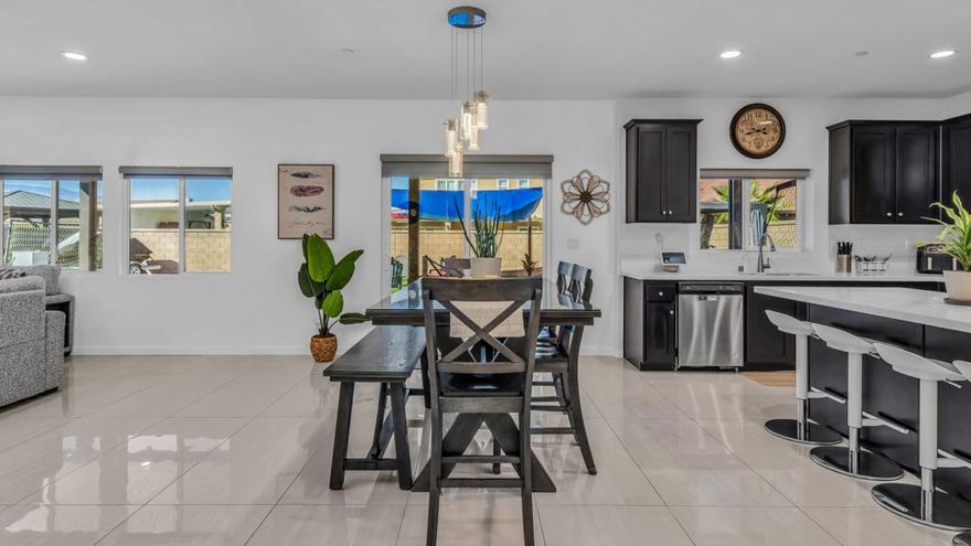 This beautifully upgraded 4-bedroom, 4 bathroom home offers comfort, style, and functionality in every detail. One of the bedrooms is a spacious attached casita with its own private entrance, kitchenette, and laundry area perfect for guests, in-laws, or rental income.Step inside to find tile flooring throughout the first floor and modern vinyl flooring upstairs. Every corner of this home has been thoughtfully upgraded from the beautifully landscaped front yard to the backyard oasis featuring two custom pergolas, ideal for relaxing or entertaining. The property also offers RV access with a huge parking space, perfect for your toys or extra vehicles. The garage is equipped with a mini-split system, keeping it cool and comfortable even during the summer months. plus OWNED SOLAR !!Located in the highly desirable Monte Vina community, this home offers convenience and accessibility , just five minutes away from grocery stores, restaurants, shopping centers, and with easy freeway access for commuters.This is truly a move-in ready home where comfort and upgrades come together beautifully. Call me today to inquire about all the upgrades , we have a detailed list available for you!