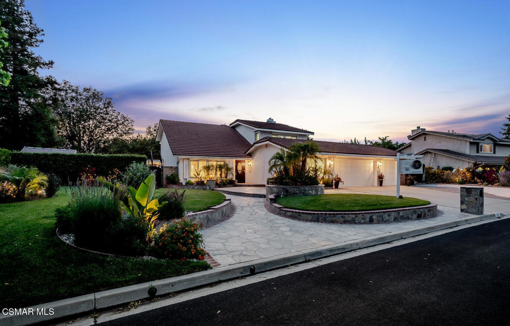 Welcome to this beautifully remodeled estate located in the desirable Fountainwood neighborhood of West Simi Valley. Situated on NEARLY ONE FLAT ACRE of horse-zoned land. This approximately 3,500 square foot home blends luxury living with thoughtful upgrades throughout. From the moment you enter, you're greeted with soaring ceilings and a dramatic curved staircase, setting the tone for the elegance that follows. The main level features newer wood flooring, Milgard windows and doors, plantation shutters, recessed lighting, and exquisite custom wood millwork. The gourmet kitchen is truly a showstopper, boasting a massive center island finished in black and cream swirl Soapstone and a large prep sink. Finishing the look are quartz countertops and backsplash, custom glass-front cabinetry, and top-of-the-line Thermador appliances including a Thermador Pro refrigerator, dishwasher drawer, 6 burner commercial-grade range, pot filler and custom hood. A wine cooler, walk-in pantry, and abundant storage complete this chef's dream space. The light-filled interior includes a downstairs bedroom with direct access to the patio, and a remodeled full bath featuring a custom vanity, marble flooring and countertops, and a large walk-in shower with floor-to-ceiling glass. Upstairs, you'll find three spacious bedrooms including one with stunning views, and another oversized room with a seating area and private access to a large wraparound balcony. The primary suite offers a peaceful retreat with multiple sitting areas, two walk-in closets, and access to the expansive balcony with breathtaking views and a private staircase leading to the yard. The primary bath is finished with porcelain tile, dual vanities, a sunken tub, and an oversized walk-in shower. Step outside to your private paradise featuring a newly replastered 11-foot deep POOL and SPA, multiple seating areas, two wooden pergolas, a gazebo, greenhouse, and fruit trees. The expansive backyard offers ample room for a potential ADU or horse facilities. There is large RV access, and generous guest parking. Additional highlights include storm shutters, an indoor laundry room with custom cabinetry, and a three-car garage with a portion converted into a workshop. Low HOA fees and endless possibilities!