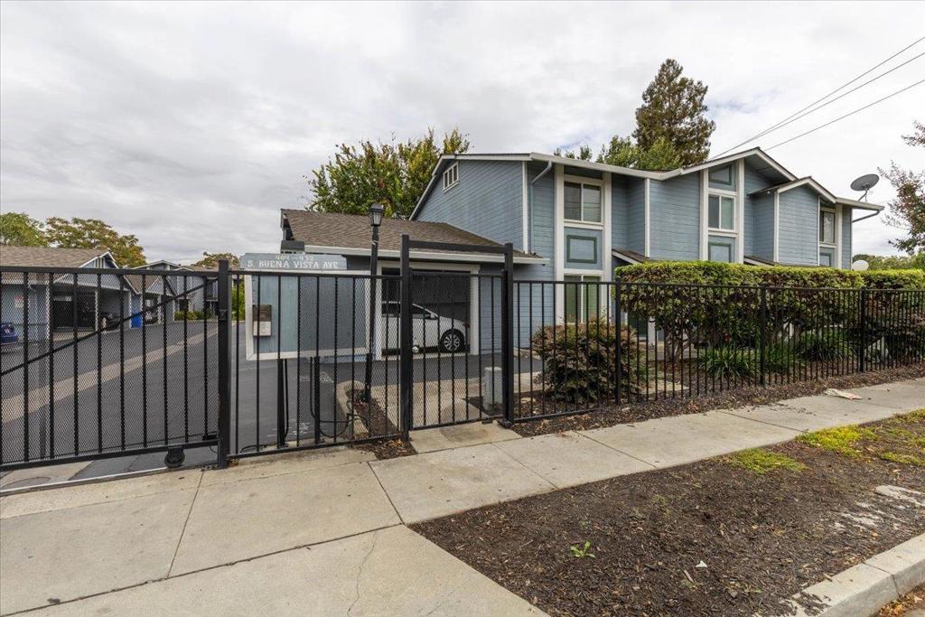 Beautifully updated Buena Vista Greens home, perfect for first-time buyers or those looking to downsize in a central Silicon Valley location! Tucked in the back of a secure gated townhome style community, this 2-level home offers 2 bedrooms, 2.5 bathrooms, and a private fenced backyard. Part of a small, well-maintained enclave of just 16 units with very low turnover, it provides a quiet and established setting. The smart floorplan includes two upstairs primary suites for privacy, plus a convenient guest half bath on the main level. The remodeled kitchen features quartz countertops, stainless steel appliances, updated cabinetry, garbage disposal, and microwave/hood combo. Light-filled living and dining areas open seamlessly to the backyard, ideal for relaxing or entertaining. Recent updates include refreshed bathrooms, recessed LED lighting, dual-pane windows, and fresh interior paint. Comforts include central heating/AC, a dedicated carport plus additional parking. Ideally located near Santana Row, downtown San Jose, SAP Center, Diridon Station, shopping, dining, and major employers, with easy access to 280, 680, 87, 101, 880, 17, and Light Rail. Truly move-in ready!