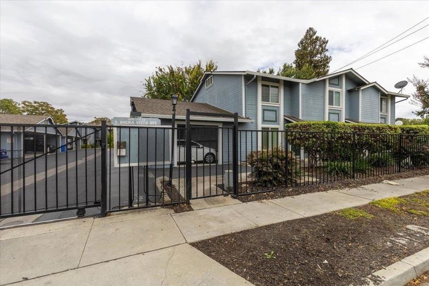 Beautifully updated Buena Vista Greens home, perfect for first-time buyers or those looking to downsize in a central Silicon Valley location! Tucked in the back of a secure gated townhome style community, this 2-level home offers 2 bedrooms, 2.5 bathrooms, and a private fenced backyard. Part of a small, well-maintained enclave of just 16 units with very low turnover, it provides a quiet and established setting. The smart floorplan includes two upstairs primary suites for privacy, plus a convenient guest half bath on the main level. The remodeled kitchen features quartz countertops, stainless steel appliances, updated cabinetry, garbage disposal, and microwave/hood combo. Light-filled living and dining areas open seamlessly to the backyard, ideal for relaxing or entertaining. Recent updates include refreshed bathrooms, recessed LED lighting, dual-pane windows, and fresh interior paint. Comforts include central heating/AC, a dedicated carport plus additional parking. Ideally located near Santana Row, downtown San Jose, SAP Center, Diridon Station, shopping, dining, and major employers, with easy access to 280, 680, 87, 101, 880, 17, and Light Rail. Truly move-in ready!
