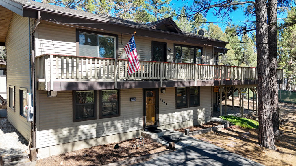 Welcome to 1068 Lookout Mountain Rd. Beautiful Big Bear. A true mountain escape nestled in the desirable Whispering Forest neighborhood, close to the National Forest. This spacious 4-bedroom, 2-bathroom home spans over 2,200 sq ft and sits on a generous 0.63-acre lot, offering privacy. Your perfect mountain reprieve... Inside, enjoy a cozy fireplace, wet bar for entertaining, and large windows that frame the natural beauty outside. Step out to a private hot tub, perfect for relaxing under the stars after a day on the lake, trails or slopes. Whether you're looking for a primary home, vacation getaway, or rental investment, this property delivers on all fronts with space, charm, and unbeatable location. Just minutes from Big Bear Lake, the village, and ski resorts!