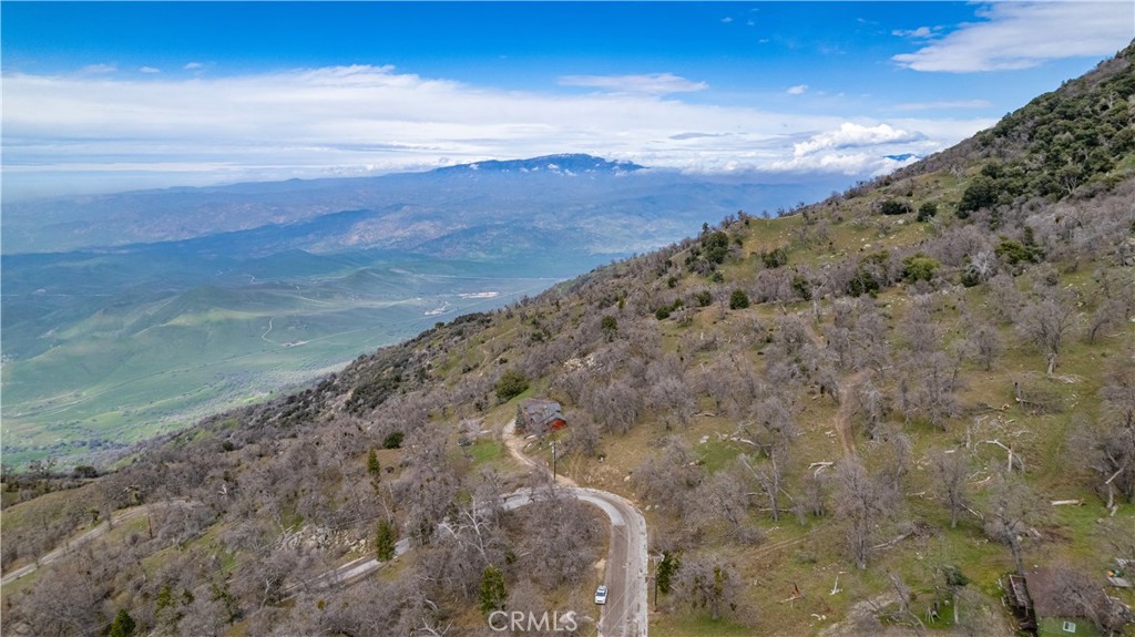 ****GREAT PRICE for 9.28 acres of private property with amazing views*****
WOW what a view from this vantage point! Come see the beautiful surroundings that you could call home. Very peaceful, lots of wildlife like Elk, Deer, Bear, Bobcats, Lions, and Bears, etc. This is a wonderful 9.28 acres to call your own. There is power and water available at the street, you will need to install meters. No hunting on this land.
This is within the gated HOA community of Bear Valley Springs in Tehachapi. The amenities include a golf course (9 holes), Olympic size swimming pool that you can swim in every season of the year because it is heated, tennis courts, indoor and outdoor pickle ball courts, an equestrian center and 55 miles of hiking and horse-back riding (no bicycles or dirt bikes allowed on trails). And there is also a gymnasium with hot sauna and spa for your workout pleasure. Don't miss out on these amenities for $2,148/yr due on July 1st every year.