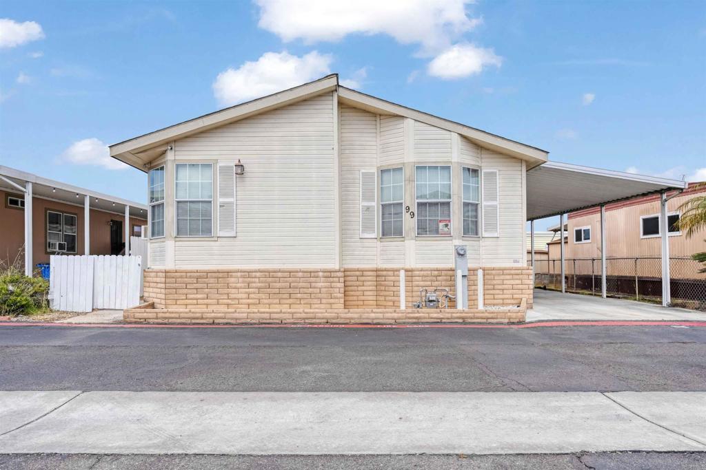 Come see this unique home that's a world of vintage charm and endless creativity! This spacious manufactured home offers a rare opportunity for buyers! Featuring both a living room and a family room, there's plenty of space to entertain, relax, or reimagine each area to suit your style. The master bedroom includes an ensuite bath with a relaxing jacuzzi tub, your own private retreat! If you're someone who enjoys design, renovation, or simply appreciates a home with a story, this is your chance to create something special. Schedule your showing today and explore the possibilities! This is located in a beautiful family park, space rent $1,005 per month. Contact listing agent to get a manufactured home loan pre-approval. SHOWN BY APPOINTMENT ONLY. Please contact Francia Castro at 619-520-9054