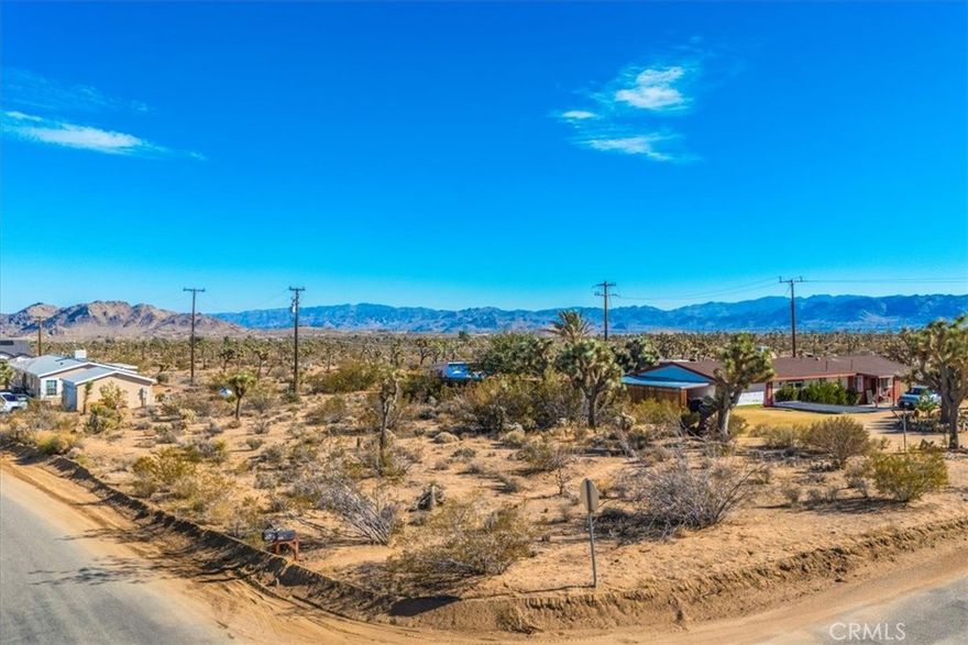Situated on a 20,800 square foot corner parcel at Lennox and Canterbury, this Mesa-area property offers a great opportunity to build in one of Yucca Valley’s sought areas. The land offers desert views and plenty of room to design your future home, a getaway retreat, or an investment property. Buyer to verify utilities, distance to services, and all building requirements.

Enjoy being just minutes from the popular local spots that make Yucca Valley so vibrant throughout the year—from the cultural events and galleries along Highway 62, to weekend farmers markets, community concerts, art tours, and seasonal celebrations. Joshua Tree National Park is a short drive away, bringing hiking, stargazing, and world-famous outdoor recreation right within reach.

A spacious corner lot in an established area, ready for your vision.