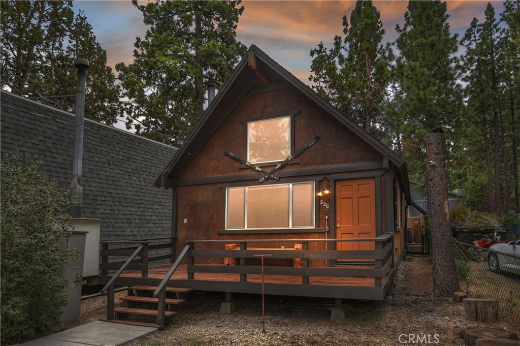 SAY HELLO TO A GOOD BUY. Wait until you see the upgrades on this 2-bedroom, one bath with huge open loft, vaulted wood ceilings, floor-to-ceiling rock wall treatment with efficient wood stove fireplace, new dual pane windows, natural gas heating, butcher-block style kitchen counters, real slate flooring, SS appliances including gas range, dishwasher, microwave and frig, ultra custom tile bathroom with clear glass enclosure, brand new custom spa and storage shed all on a low maintenace level, partially fenced lot in great Bear City location.