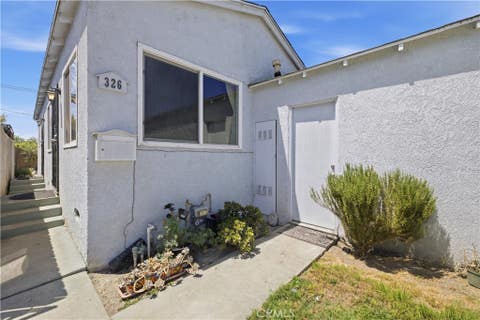Photo of 326 W Claude ST, Compton, CA 90220 (MLS # DW26161227)