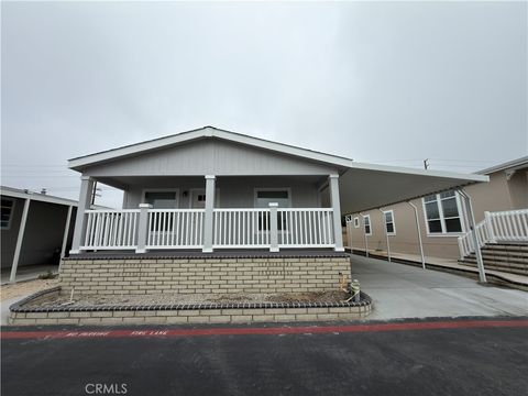 Photo of 9850 Garfield Ave Ave #18, Huntington Beach, CA 92646 (MLS # OC25241854)