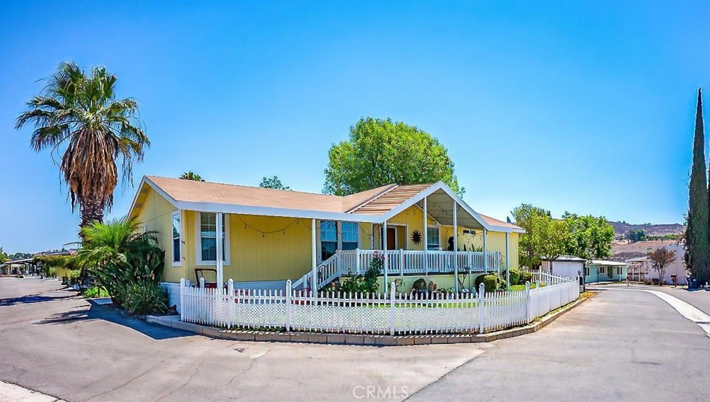 PRIDE OF THE PARK! Reduced to Sell FAST! This 3 bedroom 2 bath home built in 2005 is what you have been waiting for. The home is located on a corner lot in the heart of the Park. The large front Porch is perfect for for morning coffee, for sitting and relaxing and enjoying the Sunsets. Once inside you will notice the beautiful Wood Flooring and Base Boards, and the awesome roomy floor plan. To the right is the nice cozy Family Room with Fireplace. There are 2 bedrooms and 1 Bath also. The Large Master Bedroom is to the Left. The Master has a Walk In Closet, The Master Bath has a Large Garden Tub with Shower and solar Tube for free daytime lighting. The home also has several upgrades including completely dry walled with Bull nose corners, The Larrge Kitchen has upgraded counters and cupbards and One large skylight. You will also find Dual Pane Windows throughout the home. Recently they also added a Tankless Water Heater. The homes exterior was painted less than 2 Years ago. All this in one of the most unique and sought after Parks in the IE Rancho Caballero Park with amenities galore which include two Pools (One Olympic Size and One heated year round) Spa, Tennis Court and 2 Pickleball Courts, Dog Park, and Large Clubhouse, Workout Room and Ball Field and Kids Playground.