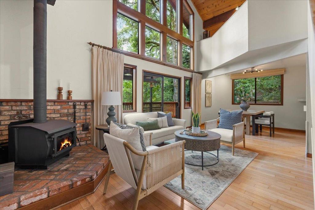 Tired of the same old boring houses? Want something different? Welcome to 544 Gold Ave., an architecturally interesting A-Frame in an idyllic Felton location. Nestled among mature trees and flooded with natural light is this 2BR/2BA charmer with 1,247 square feet and tons of usable outdoor space. Enter into the double-height ceiling living room with a wood burning stove and a wall of windows, and experience the ultimate flow with a dining room off the open concept kitchen. With one bathroom downstairs (along with the laundry room) and the primary suite and a versatile loft space upstairs--think gym, office, or both!--this home has that "it" factor that is so often lacking with ordinary home. Don't settle for ordinary when you could have 544 Gold Ave., an extraordinary home in the hills mere minutes away from downtown Felton shops and restaurants, the Farmer's Market, Henry Cowell State Park, and much more.