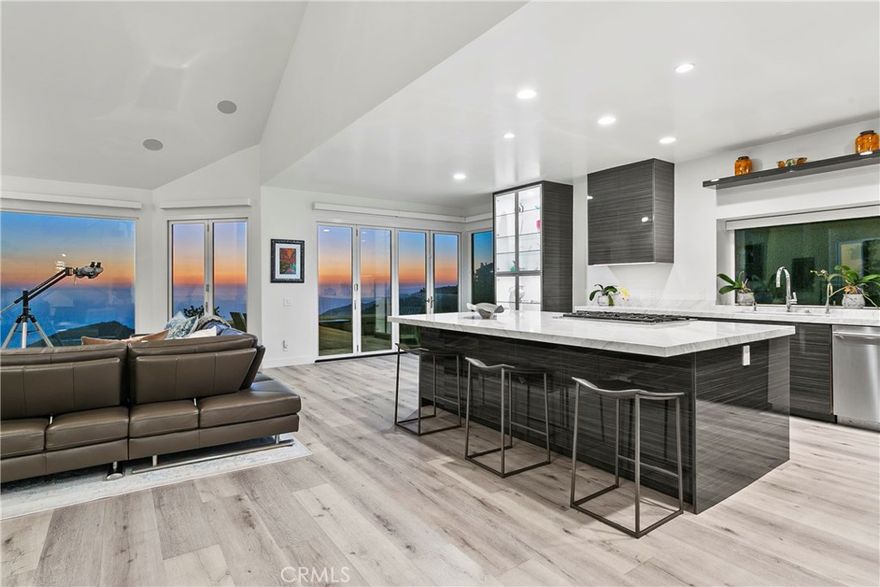 Experience unobstructed panoramic ocean and coastline views , Catalina Island, and sunset views from this luxurious, contemporary Mediterranean home nestled in the prestigious gated community of Laguna Sur. Oversize glass doors frame the dramatic coastal vistas and infuse the open-concept layout with an abundance of natural light and help this entertainer's delight blend seamlessly with the outdoors. Modified from the original builder floorplan to create an open-concept space, the chef’s kitchen opens to the living area and is sure to impress with a 6-burner stove, marble countertops, soft-close custom cabinetry, a wine refrigerator in the kitchen and a walk-in pantry. Enjoy luxury, innovation throughout with soaring ceilings, designer finishes, and smart home features including automation, zoned HVAC with humidity control, a tankless water heater, and energy-efficient appliances. The tranquil primary suite is also modified to create an open concept space, offering a spa-like escape with over-sized custom shower including Mr. Steam steam shower, dual massage showerheads plus rain showerhead, a jetted BainUltra tub, and a generous walk-in closet. Additional features include custom built-ins, whole-home data wiring, integrated surround sound, a central vacuum system, a loft and additional attic and a TONAL Smart Home Gym. Residents of Laguna Sur enjoy exclusive resort-style amenities including two pools, a spa, and 2 tennis/pickleball courts. This prime coastal location is just minutes from the Waldorf Astoria and Ritz-Carlton resorts, the El Niguel Country Club, the charm of Laguna Beach Village, the Dana Point Harbor, and a myriad of dining and shopping options in the newly renovated 'Lantern District' in Dana Point. Badlands and Sea View parks are just outside the gates and offer an abundance of trails and recreational opportunities for the outdoor enthusiast.