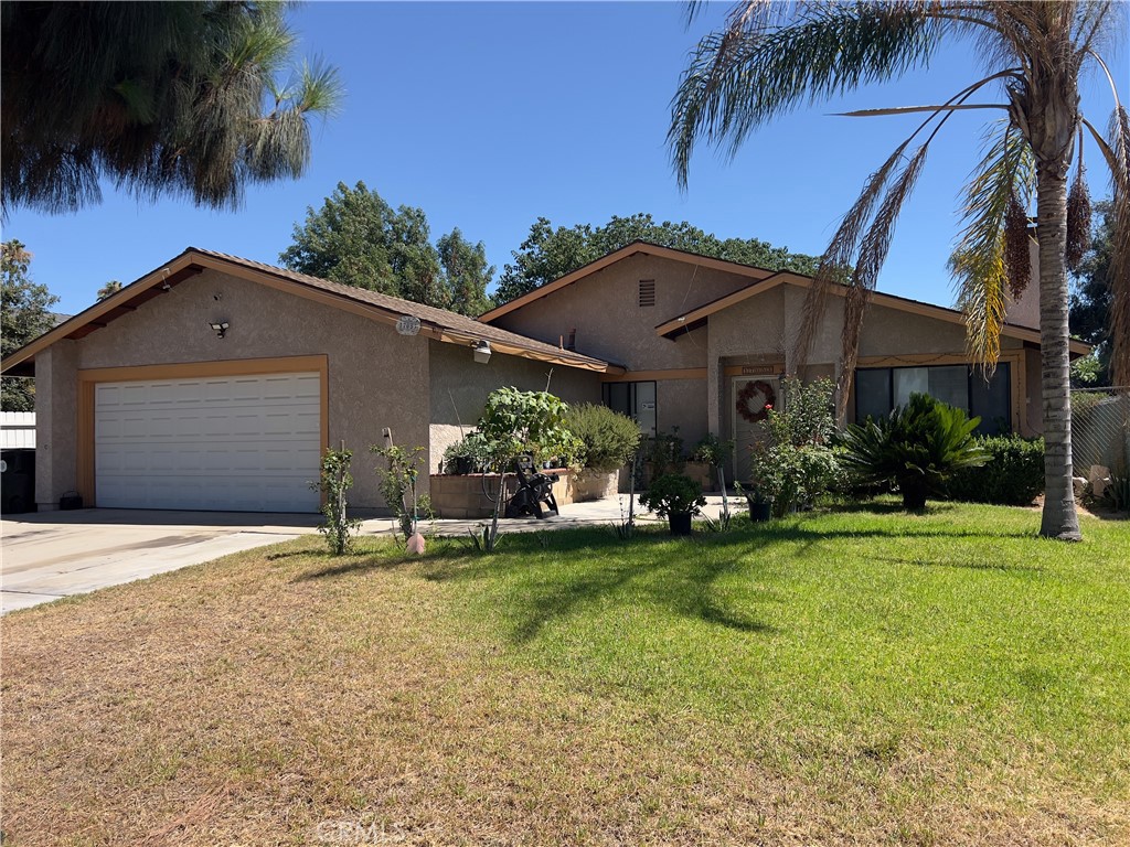 This beautifully maintained, move-in ready 3 bedroom, 2 bath bungalow is perfectly situated in a quiet cul-de-sac in a well-established Fontana neighborhood surrounded by mature tree-lined streets. Set back from the road for added privacy and curb appeal, this home features a spacious modern open-concept layout with vaulted ceilings and abundant natural light throughout. The large kitchen includes ample counter space, extensive cabinetry, a breakfast bar, and opens to a formal dining area—ideal for hosting and family meals. The adjacent living room boasts a stunning floor-to-ceiling stone fireplace, creating a warm and inviting space to relax or entertain. Down the hall, you’ll find two generously sized bedrooms and a full bathroom with a tub/shower combo. The private master suite offers excellent natural light, dual sinks, and a large walk-in shower. Additional highlights include a newer roof (replaced 5 years ago), a brand new A/C system (installed 2 years ago), a dedicated laundry area, and a 2-car attached garage with direct access. The oversized lot features lush green front and back yards—perfect for kids, pets, or entertaining—along with a covered patio ideal for summer barbecues. Professionally landscaped with palm trees adding to its curb appeal, this home is truly turnkey. Conveniently located just minutes from Kaiser Medical Center and major freeways including the 10, 15, and 215, this commuter-friendly gem offers exceptional value in a prime Fontana location. Whether you’re a first-time buyer, a growing family, or looking for a solid investment, this property is a must-see!
