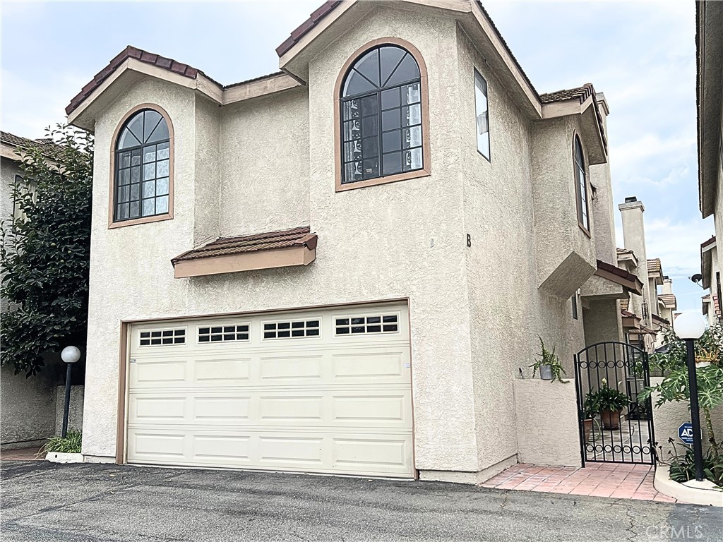 Welcome to this spacious 2-story condominium offering 1,266 sq. ft. of living space in a gated community. This home features 3 bedrooms, 2.5 bathrooms, a versatile upstairs loft, and a private balcony off the primary suite. Additional highlights include a two-car garage, a cozy private yard with a gardening section, and natural light throughout. Conveniently located near schools, shopping centers, a community center, and freeway access, this home is ideal for anyone. This home is still owned by the original owners.