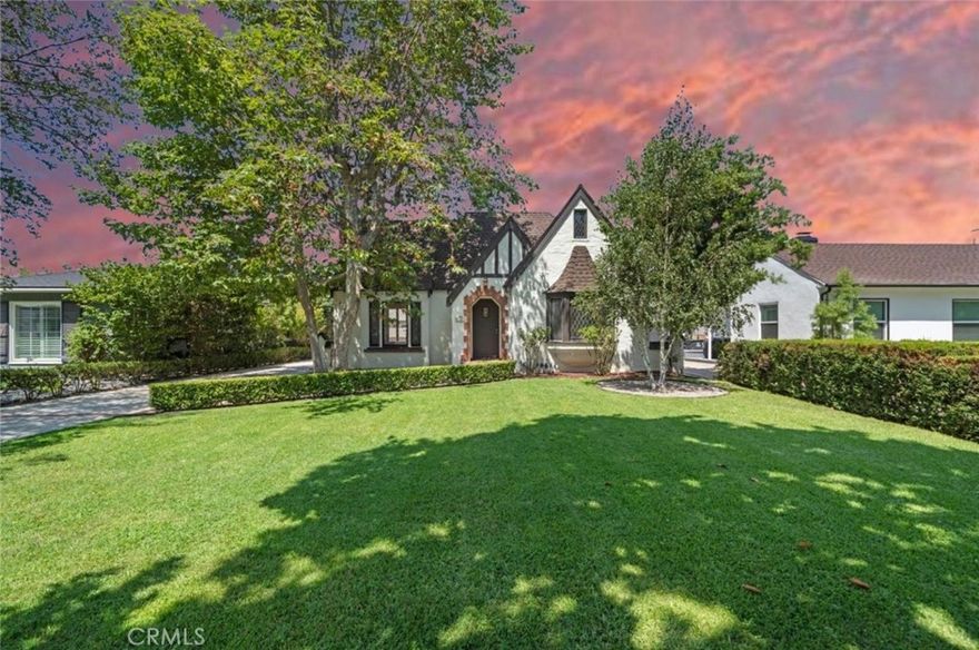 PARK SANTIAGO PRICE CUT ALERT $100,000 for FAST SELL!! MORE THAN 200K in a 2025 ELEGANT REMODEL, revival 1930 Tudor Gem on Poinsettia Street. Discover a remarkable opportunity with this residence, nestled in the charming neighborhood of Santiago Park, Santa Ana. This captivating 4-bedroom, 3-bathroom home boasts 2,070 square feet of elegantly designed living space, set on a generous 8,360 square foot lot. As you step into this prestigious tree-lined street, you'll be enchanted by the beautiful streets filled with vintage custom homes. The house welcomes you with a large open floor plan, enriched with abundant natural light and an inviting atmosphere. The main level features a full suite bedroom, perfect for guests or multi-generational living, while the upper floor accommodates additional private retreats. The heart of this home is its gourmet kitchen, equipped with high-end chef appliances, including a wine fridge, catering to all your culinary adventures. The beautiful dining room seamlessly opens onto a large paved patio, ideal for outdoor dining and entertaining. Relax and unwind in the spacious family room or enjoy leisure activities in the media room, perfect for kids to play or watch TV. Beyond the interior, the meticulously landscaped backyard is a true sanctuary. It features an outdoor kitchen and fireplace, surrounded by mature fruit and citrus trees, offering a private oasis for relaxation or entertaining. The very large backyard holds potential for an Accessory Dwelling Unit (ADU), water, electricity and gas pre-upgraded, adding tremendous value and versatility to the property. Additional amenities include a washer/dryer in-unit, air conditioning, and parking for both everyday vehicles and RVs. The property also features a 2-car garage with attic storage, a very long driveway, and a generously sized basement storage room. Embrace the best of both worlds with a lovely neighborhood ambiance and the convenience of great entertainment close by. Santiago Park, recently renovated with new paths and play areas, provides an idyllic setting for outdoor activities and community gatherings. Seize this rare opportunity to own a piece of architectural elegance with modern amenities in one of Santa Ana's most desirable neighborhoods.