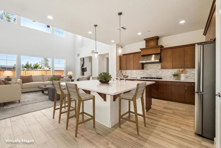 Thoughtfully designed for both comfort and versatility, this spacious Sea Haven residence offers 6 bedrooms, a loft, and a den. The main level includes 3 bedrooms and a den, ideal for multi-generational living, guests, or a home office, while the upstairs features 3 additional bedrooms and a generous loft, perfect for work, play, or relaxation.The home is filled with natural light from morning to evening, enhanced by warm, neutral tones and thoughtfully chosen finishes throughout. The upgraded Maplewood cabinetry, pre-plumbed for A/C and water softener, and other modern touches reflect both quality and care.Step outside to enjoy the backyard, buffered with space and mature trees, offering added privacy. A spacious two-car garage and extended driveway provide ample parking and storage. Conveniently located just minutes from shopping, dining, and Highway 1, with quick access to Monterey, Carmel, and the entire Peninsula, this home is a true coastal retreat with room to grow.