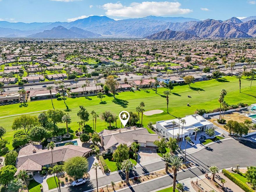 Experience exceptional fairway living in the historic Bermuda Dunes Country Club. This single-level turnkey furnished home sits on a beautifully landscaped lot with sweeping golf-course and mountain views, offering both privacy and a strong connection to the outdoors.The open floor plan is bright and spacious, featuring a double-sided fireplace anchoring the great room, with additional fireplaces in the den and the primary suite. The primary suite occupies its own private wing and includes a comfortable den with fireplace, while two guest bedrooms on the opposite side each offer ensuite baths.The backyard is designed for easy indoor-outdoor living, complete with a pool, spa, calming water features, and a well-appointed outdoor kitchen--ideal for everyday relaxation or entertaining.Additional highlights include a three-car garage for two large cars and one for a small car or golf cart, and excellent closet and storage space throughout.Located in a prime central area, the home is minutes from El Paseo, the Coachella Valley Fairgrounds, Acrisure Arena, the Indian Wells Tennis Garden, Old Town La Quinta, Downtown Indio, and more. Low HOA of $220/month includes cable and internet.