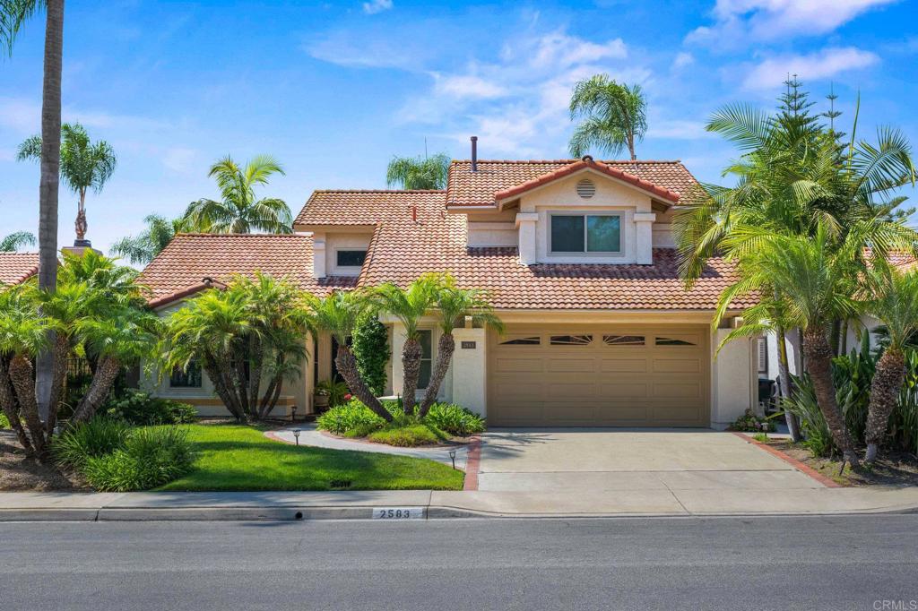 Lovely home in a quiet Shadowridge neighborhood, offering airy living spaces, abundant natural light, and a convenient downstairs primary suite. With all essential rooms (including laundry) on the main floor, you can enjoy the ease of single-level living. The generous, private backyard is perfect for both relaxation and entertaining, featuring a shaded patio and thatched palapa for multiple dining and lounging areas. Lush landscaping and mature trees create a peaceful, secluded atmosphere; ideal for summer barbecues, quiet mornings with coffee, or soaking in the gentle coastal breeze. Close to Shadowridge Golf Club, Rancho Buena Vista High School, Downtown Vista, and access to the 78.