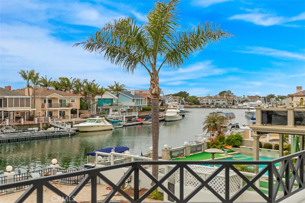 Discover the epitome of coastal elegance at 16201 Santa Barbara Lane, a stunning waterfront residence tucked away in the prestigious Huntington Harbor community. This impeccably maintained, turnkey residence offers a rare opportunity to experience the ultimate in coastal luxury, blending timeless elegance with modern comfort across 4,125 square feet of thoughtfully designed living space. Boasting 5 spacious bedrooms and 4 full bathrooms, this home is ideal for multigenerational living or accommodating guests with ease. The light-filled open floor plan features soaring ceilings, walls of glass, and seamless indoor-outdoor flow, creating an inviting atmosphere perfect for both relaxed family living and sophisticated entertaining. At the heart of the home, the gourmet kitchen is a chef’s dream—complete with top-of-the-line stainless steel appliances, custom cabinetry, a generous center island, and water views that make meal prep a joy. The living and dining areas offer uninterrupted views of the harbour, with multiple access points to the expansive patio, ideal for al fresco dining, lounging, or simply enjoying the ocean breeze. Upstairs, the primary suite is a true sanctuary, featuring a private waterfront balcony, cozy fireplace, spa-like ensuite bath with soaking tub, dual vanities, and an oversized walk-in closet. Additional bedrooms are equally well-appointed, offering flexibility for a home office, gym, or creative space. Step outside to your private paradise—complete with a 40-foot boat dock, providing easy access to open water. Whether you're cruising the coast, kayaking through the channels, or entertaining guests as the sun sets over the marina, this home offers a lifestyle that few can match. Located on a tranquil cul-de-sac in one of Huntington Harbor’s most coveted neighborhoods, this exceptional property combines the peace of waterfront living with convenient proximity to shops, dining, award-winning schools, and the beach.