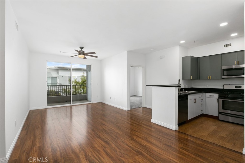 TOP floor unit at Stadium Lofts, where modern, convenient living meets sophistication! This spacious 2 bedroom, 2 bathroom condo is on the 4th floor with no neighbors above and is located in a quiet interior location overlooking the courtyard. Home features on-trend two tone kitchen cabinetry, stainless steel appliances and granite countertops. Bedroom carpet has just been replaced. The condo also comes complete with in-unit laundry, central heating and cooling, and 2 assigned parking spots in the secure garage. Residents of Stadium Lofts also have access to a sparkling pool, spa, and fitness center. Conveniently located in the Platinum Triangle in Anaheim, this condo is just steps away from world-class dining, shopping, and entertainment at the nearby Anaheim Resort, Disneyland, and Angels Stadium.