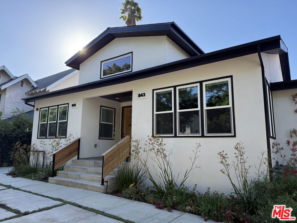 NEWLY BUILT MODERN ON LA FAYETTE PARK PLACE | SILVER LAKE Perched above Sunset on one of Silver Lake's most desirable tree-lined streets, this newly built 2-bedroom, 2-bath residence offers the perfect balance of tranquil neighborhood living and walkable urban convenience, just one block from Sunset's restaurants and nightlife. Inside, thoughtfully designed spaces showcase an abundance of natural light throughout the open-concept layout. The modern kitchen anchors the living area with a quartz island, custom cabinetry, and stainless steel appliances that inspire home cooking. A gas fireplace adds warmth and ambiance to the living space, creating the perfect focal point for relaxed evenings at home. Clean lines, warm wood-tone flooring, and quality finishes throughout reflect meticulous attention to detail. Both bedrooms offer comfortable proportions with ample closet space. Two full bathrooms feature contemporary fixtures and finishes. In-unit laundry, tankless water heater, central air with smart thermostats, and secure automatic gates handle the practical side of modern living. Outside, native landscaping maintained by a master gardener adds authentic California character to this professionally managed property. The real draw: La Fayette Park Place is that rare Silver Lake street. It's wide, quiet, genuinely neighborly where you can walk to Tacolina for margaritas on Taco Tuesday, grab a morning caf con leche at Cafe Tropical, or loop the reservoir for your daily run, all without the chaos of Sunset at your doorstep. The best of Silver Lake is your neighborhood, not your commute. Quality construction in the right location at a fair price. A rare find in today's Silver Lake. Move-in ready option: Designer furnishing packages available, including fully equipped move-in ready options.