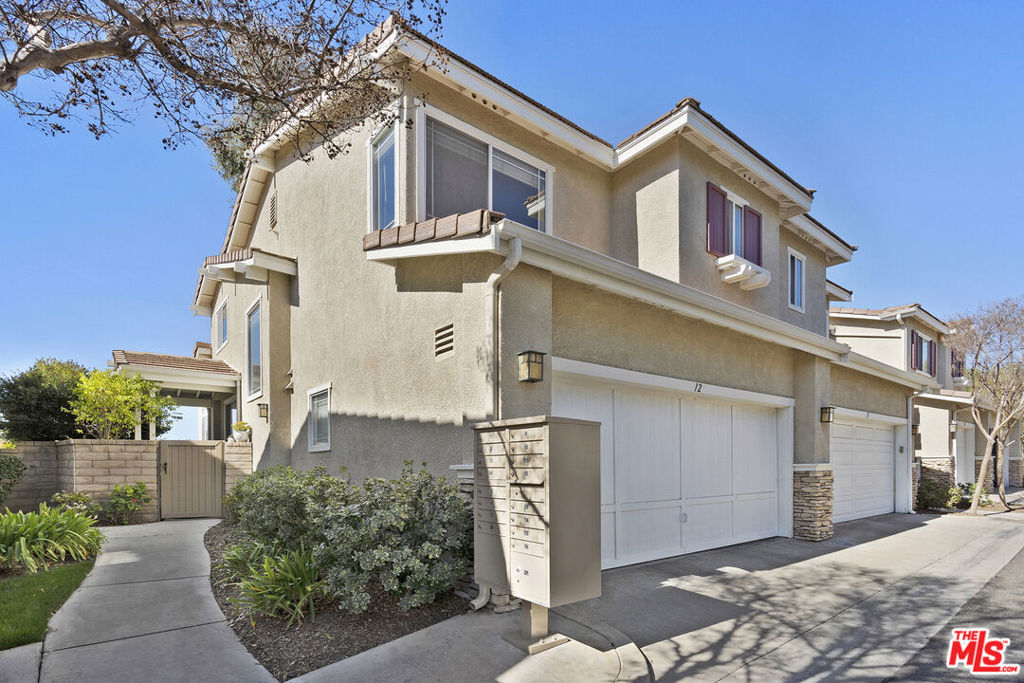 Discover this rare 3-bedroom, 2.5-bath townhome in Valencia, featuring 1,334 square feet of living space and unrivaled privacy with no rear neighbors and only one shared wall. Enjoy a private entrance that opens to a spacious wrap-around patio with picturesque park views. Step inside to an inviting living area highlighted by hardwood floors and a two-sided fireplace as the focal point. The open kitchen boasts a breakfast bar, granite countertops, and stainless steel appliances. Upstairs, the primary suite offers a dual sink vanity and a spacious walk-in closet, complemented by two additional bedrooms and a full bath.Additional features include fresh paint, Ecobee4 smart thermostat, whole house water filtration system, dual-pane windows, and an attached 2-car garage with direct access and storage. Located in the desirable Montana Townhomes, you'll be near Blue Ribbon schools, parks, dining, Bridgeport Marketplace, and miles of paseos. This townhome is the perfect blend of comfort and convenience!