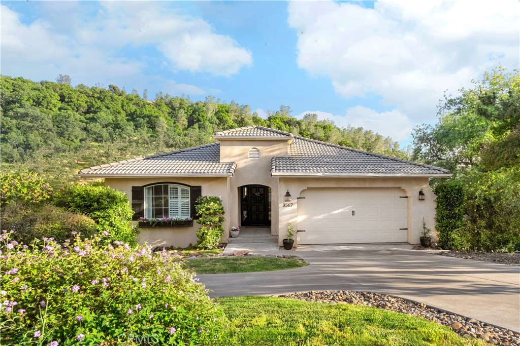 Beautiful Canyon Oaks Country Club Home with Breathtaking Views
Located at the end of a quiet street in the exclusive Canyon Oaks Country Club, this gorgeous 4-bedroom, 3-bathroom, 2,795 sqft home offers stunning panoramic views of the rolling hills and canyons. The main level features a show-stopping, updated kitchen featuring a large custom-built island, quartz countertops, crisp white cabinetry, subway tile backsplash, and upgraded stainless steel appliances. Open to the spacious living room, you’ll enjoy a cozy fireplace with a white mantle and direct access to a balcony where those sweeping views take center stage. This level also includes a formal dining room, laundry room, and a split-bedroom layout—one side with a guest bedroom and full bathroom, the other with a serene primary suite offering a soaking tub, separate shower, dual-sink vanity, and walk-in closet. Downstairs is a perfect private retreat for guests, complete with two bedrooms, one bathroom, a bonus room, and another private balcony to soak in the scenery. The backyard is ideal for entertaining, with a large patio area, hot tub, grassy space, and a seasonal creek adding to the charm. Additional features include a whole house fan, solar, new carpet throughout, and a 2-car garage. Don’t miss your chance to experience the Canyon Oaks lifestyle—schedule your private tour today!