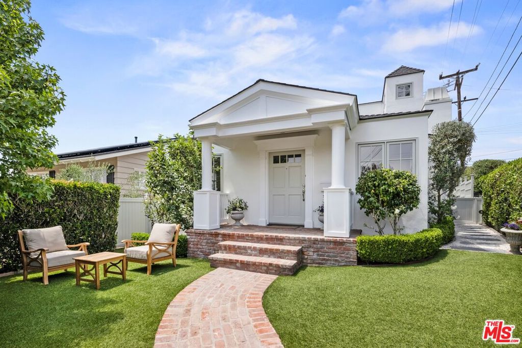 3 Bedrooms | 3 Bathrooms + BONUS ROOM. Beautifully upgraded and ideally located in Manhattan Beach's prestigious Sand Section, this bright and spacious home offers the perfect blend of timeless charm and modern luxury. Nestled on a unique cul-de-sac, this exceptionally private corner lot sits just steps from the scenic greenbelt and award-winning Robinson Elementary School. A welcoming entry gate, manicured hedges, and a serene front yard with shade and citrus trees, synthetic turf, and a classic covered porch set the tone for relaxed coastal living. Inside, the home features approximately 2,509 sf of refined living space with three bedrooms, three full baths, and a versatile bonus room-ideal for a home office, gym, playroom, or media lounge, with attic access and sweeping views of Palos Verdes and city lights. The main level includes a sunlit living room with fireplace, a formal dining room with coffered ceiling, and a comfortable family room that opens to a chef-inspired kitchen-perfect for entertaining or everyday living. The kitchen boasts granite countertops, an island, white Shaker cabinetry with built-in pantries and desk, a full tile backsplash, soaring ceilings, under-cabinet lighting, and premium stainless steel appliances-including a double KitchenAid oven, and a new Bosch dishwasher, stove, and refrigerator. A French door leads to a private, stone-paved patio ideal for al fresco dining, weekend barbecues, and effortless outdoor entertaining. Two generously sized bedrooms-one with an ensuite bath-are also located on this level, along with a beautifully updated laundry room featuring custom cabinetry, tile floors, a utility sink, new washer and dryer, and convenient outdoor access. The attached two-car garage impresses with a new epoxy floor, built-in storage, and fire sprinklers. Upstairs, the luxurious primary suite offers a peaceful retreat, complete with a cozy sitting area, bay window with built-in seating, walk-in closet, and spa-like bath with a soaking tub, walk-in shower, and dual vanities. Thoughtful upgrades abound, including hardwood floors, recessed LED lighting, glass door hardware, dual-paned windows, fresh interior paint, and extensive custom millwork with crown molding, wainscoting, and tailored window and door casings. Originally built in 1940, this beautifully reimagined home is just minutes from the beach, local piers, top-rated schools, popular shops and restaurants, and the best of the South Bay lifestyle with convenient access to LAX and beyond.