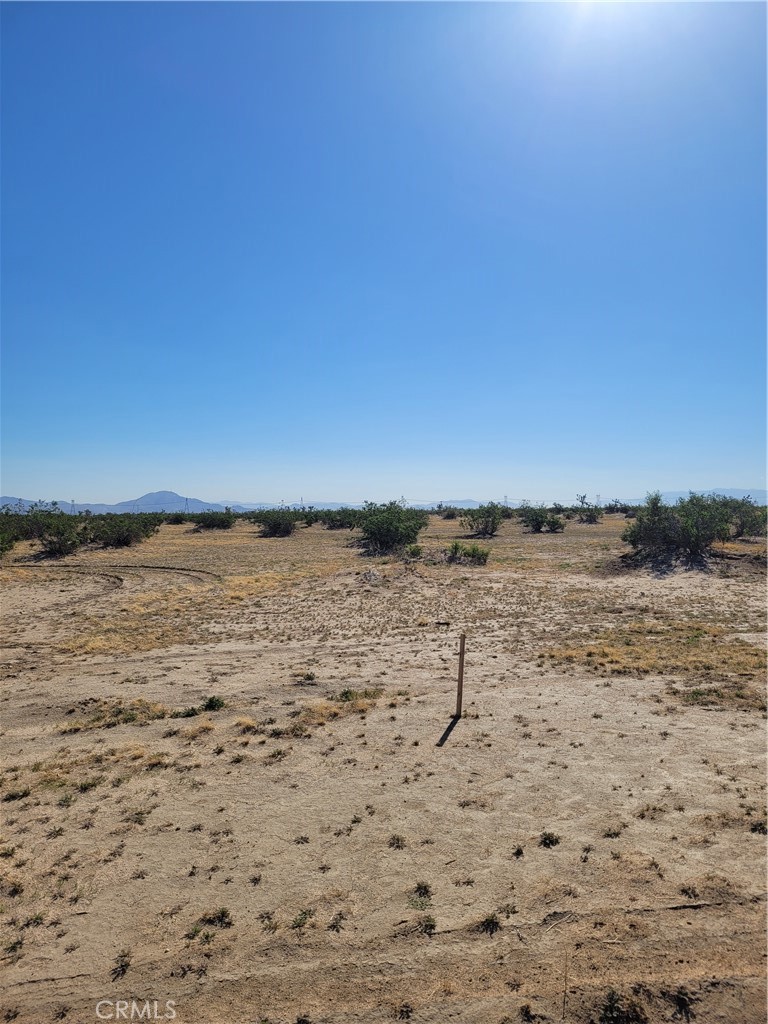 Spacious 5-acre lot in Adelanto, just off paved El Mirage Rd! Enjoy the peace and quiet of rural living while staying close to nearby homes and amenities. Perfect for building your dream home or creating a private retreat with room to grow. Explore the possibilities and make this land yours! Invest today! APN: 0458-122-70-0000. Latitude:34.590256, Longitude:-117.479613.