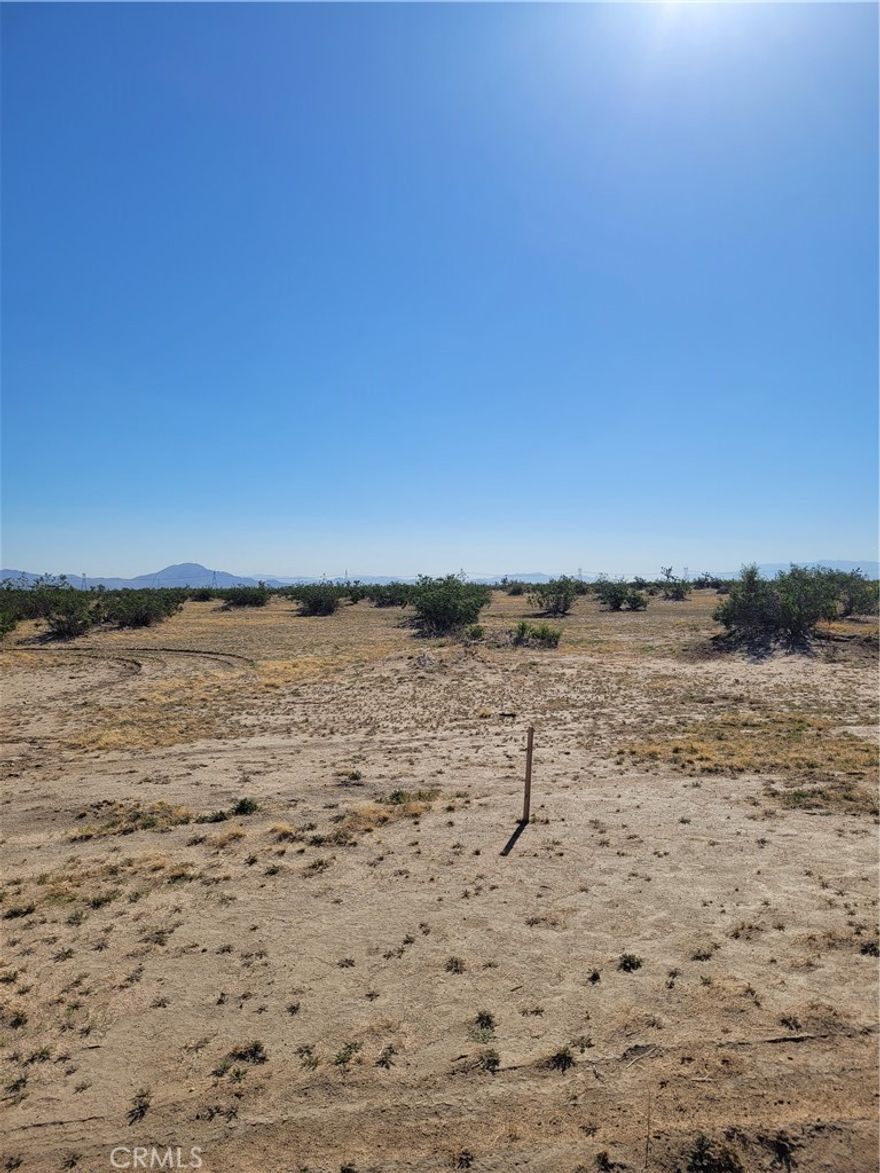 Spacious 5-acre lot in Adelanto, just off paved El Mirage Rd! Enjoy the peace and quiet of rural living while staying close to nearby homes and amenities. Perfect for building your dream home or creating a private retreat with room to grow. Explore the possibilities and make this land yours! Invest today! APN: 0458-122-70-0000. Latitude:34.590256, Longitude:-117.479613.