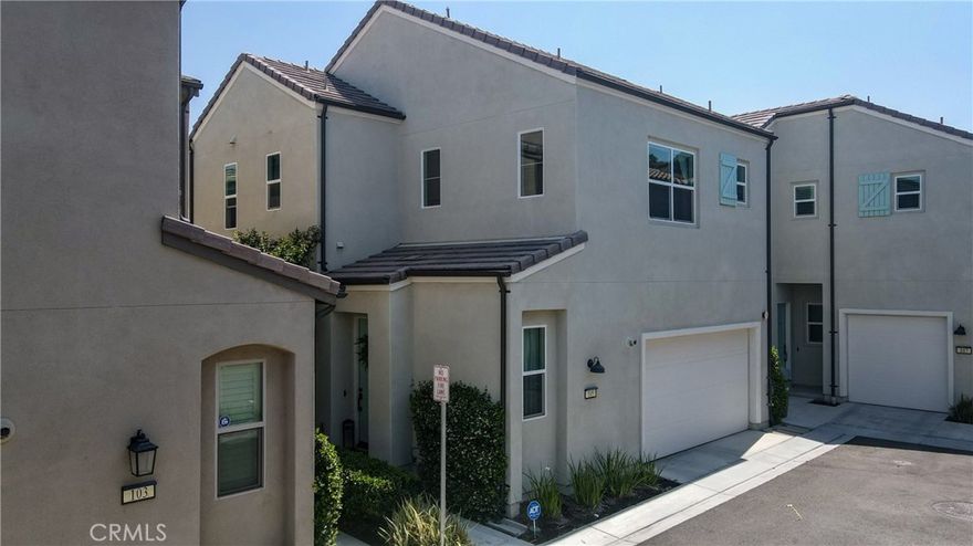 Beautifully Upgraded Home in the Sought-After City of Corona! This turn-key property offers 1,626 sq ft of stylish living space, featuring 3 bedrooms, 2.5 bathrooms, and a 2-car attached garage. Step inside to an open floor plan with high ceilings, recessed lighting, dual-pane windows, laminate flooring, and plush carpeting throughout. The modern kitchen boasts white cabinetry, quartz countertops, glass tile backsplash, stainless steel appliances, pantry, and direct access to the backyard—perfect for indoor-outdoor entertaining. The spacious primary suite showcases elegant wainscoting, recessed lighting, and an upgraded en-suite bathroom with dual vanities, a walk-in shower, and walk-in closet. Bedrooms 2 and 3 include ceiling fans and share a well-appointed full bath. Additional features include a convenient indoor laundry room with cabinets and shelving. The low-maintenance backyard is finished with pavers, artificial grass, and vinyl fencing—ideal for relaxing or entertaining. Enjoy resort-style amenities in the Bedford community, including parks, walking and hiking trails, a clubhouse, and a sparkling community pool and spa. Conveniently located near shopping, dining, and entertainment. Move-in ready—don’t miss this one!
