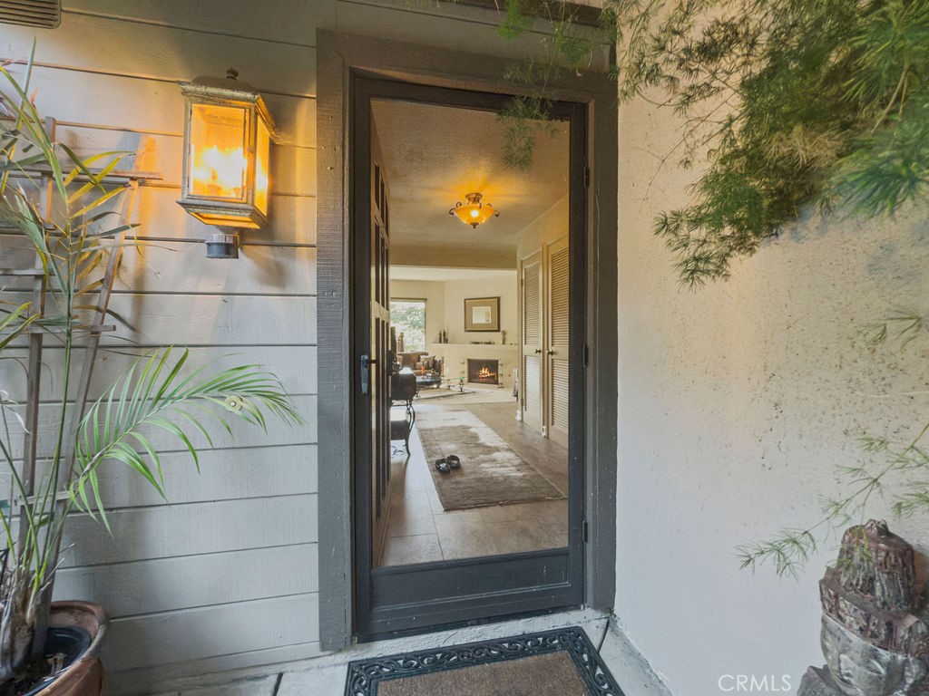 Incredibly private garden home in the Rancho San Joaquin neighborhood of Irvine. This 2 bd, 2 ba downstairs unit is surrounded by two patios with a wrap-around pathway. The large garden is abundant with plants and very private. There are both areas of bright sunshine and deep shade. Inside, large living room windows face south and let in wonderful light. The two bedrooms each have ensuite bathrooms. The main bedroom is large, with abundant closets, dressing area and the bathroom has an attractive tiled step-in shower. The secondary bedroom has a built-in desk with a murphy bed and the bath has a tub. The garage for this home is the very closest garage. Sold in "as is" condition. RSJ neighborhood is known for its beautiful mature sycamore trees and wildlife.