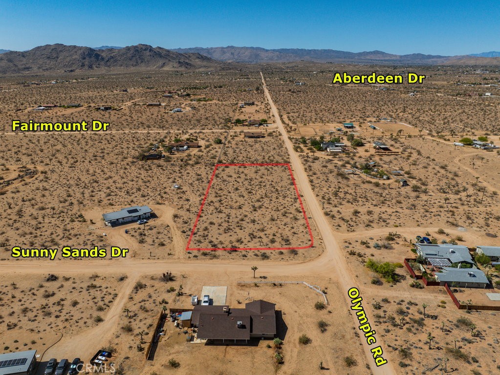 Surrounded by Beautiful Houses
Fabulous corner lot on wide and well-maintained dirt road, not too far from paved Aberdeen Dr. Underground power is on the street with a transformer right in front of the lot. Water and phone/cable lines are also in the street. Everything you need is just a short drive away. This lot is in San Bernardino County jurisdiction and zoned for HV/RL (Homestead Valley/Rural Living) which allows for single family homes and incidental agriculture uses. This is really an unique opportunity to enjoy a peaceful desert lifestyle with expansive open spaces and breathtaking natural beauty. Do not miss this opportunity to make your dream come true on this blank canvas. Please note that the boundaries represented in the photos are only an estimation. Buyers should verify boundaries, zoning and utilities, ensuring every aspect aligns with their vision for the property. Address has been assigned by the county.