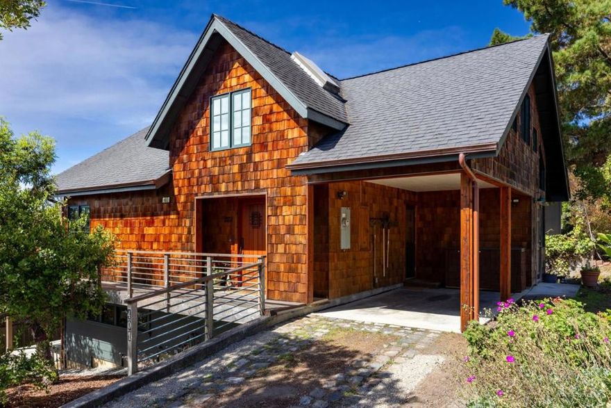 Discover this one-of-a-kind Coastal Craftsman gem in sunny El Granada. Custom-built in 2003, this meticulously maintained home features approximately 2,001 sqft of living space, thoughtfully designed with timeless character and high-end finishes. Interior highlights include soaring vaulted ceilings, reclaimed old-growth redwood finishes, hardwood floors, solid wood cabinetry, custom doors, and a cozy wood-burning stove. The European-style kitchen is perfect for entertaining, equipped with custom countertops and premium Miele and Bosch appliances. Enjoy seamless indoor-outdoor living with a wrap-around deck offering west-facing views toward the Pacific Ocean, ideal for morning coffee or sunset gatherings.The lower level offers in-law unit potential with a separate entrance and driveway for guests, extended family, or rental income. A spacious bonus room and light-filled storage area offer flexibility for a studio, home gym, workshop, or creative space. The loft area with peek-a-boo ocean views adds further versatility for a home office/bedroom, or retreat. Location and lifestyle highlights include, walkability to Surfers Beach, Coastal Trail, Pillar Point Harbor. Easy access to Hwy 1 for commutes to SF,  Silicon Valley. Close to water sports: surfing, kayaking, paddle boarding.