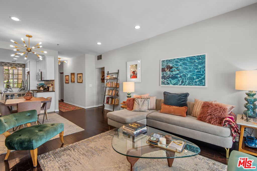 Fantastic turnkey condo located in the heart of Tujunga Village, just steps from all the shops and restaurants. This lovely 2 bedroom 2 bathroom sits on the first floor of a quiet 17-unit complex. A peaceful courtyard entry leads to this spacious and well-appointed unit. The foyer leads to a large, open great room with engineered wood floors. The remodeled galley kitchen provides great use of the space and includes updated cabinetry, engineered wood floors and stainless steel appliances. Sliding glass doors open to the large, private and tranquil back patio. Washer and dryer hookups located in the hallway leading to the two bedrooms. The primary bedroom with en-suite bathroom receives radiant natural light with direct access to the back patio through its own sliding glass door. The spa-like master bathroom includes a large stall shower, dark wood cabinetry with ample counter space and storage nook. Easy parking with 2 assigned spaces located in the covered, secured garage.