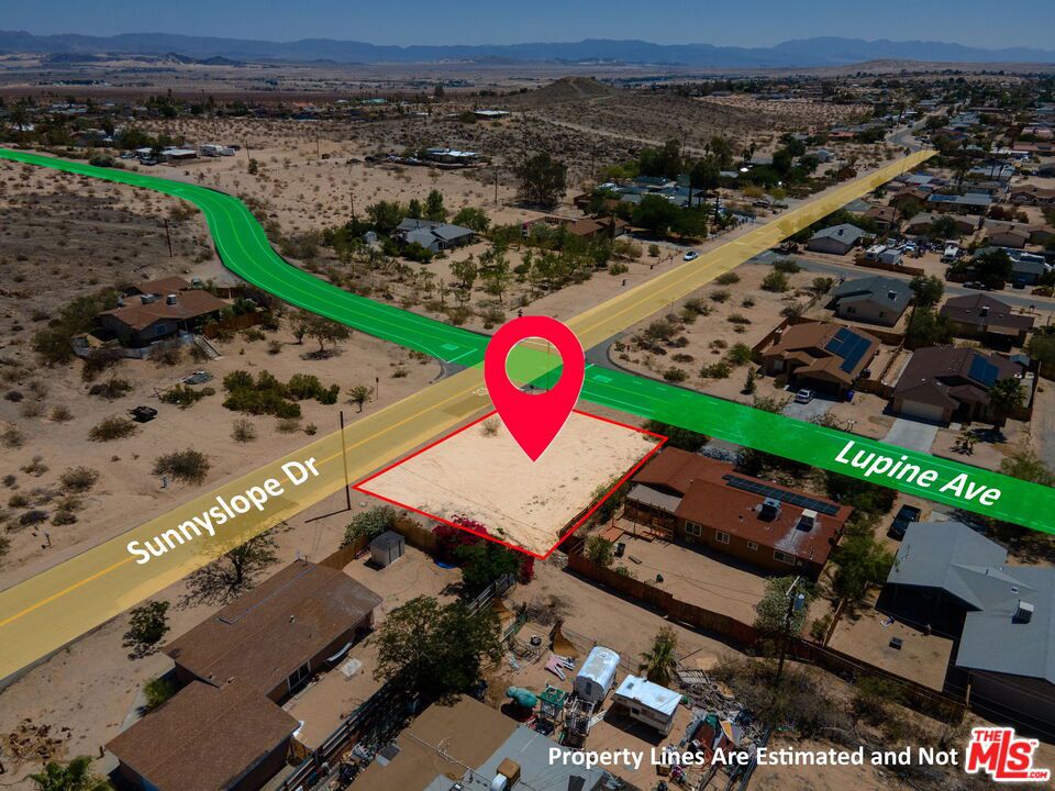 Fantastic Corner Lot in the Chocolate Drop Area of 29 Palms! This prime 8,260 sq. ft. corner lot in the desirable Chocolate Drop neighborhood is ready for your next Hi-Desert building project! Ideally situated at the intersection of paved Lupine Avenue and Sunnyslope Drive, this property offers easy access and outstanding visibility. Utilities? You're in luck. Public water and power are available at the street (buyer to verify all utilities). Even better - there are no protected desert plants on the property, making development smoother and more straightforward (buyer to verify). Location is everything, and this lot puts you right in the heart of 29 Palms. Enjoy quick access to local shops, restaurants, the Marine Corps base, Tortoise Rock Casino, the downtown Cultural Center, and more. Whether you're building a personal home, a vacation getaway, or an investment property, this spot delivers convenience without sacrificing proximity to outdoor adventure. Take a walk around the property and let your imagination run wild. With space to spread out and endless potential, this is your opportunity to bring your desert dream home to life. Don't miss this gem - come see it in person today!