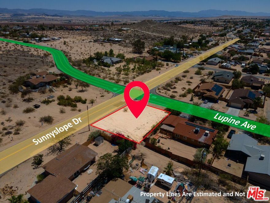 Fantastic Corner Lot in the Chocolate Drop Area of 29 Palms! This prime 8,260 sq. ft. corner lot in the desirable Chocolate Drop neighborhood is ready for your next Hi-Desert building project! Ideally situated at the intersection of paved Lupine Avenue and Sunnyslope Drive, this property offers easy access and outstanding visibility. Utilities? You're in luck. Public water and power are available at the street (buyer to verify all utilities). Even better - there are no protected desert plants on the property, making development smoother and more straightforward (buyer to verify). Location is everything, and this lot puts you right in the heart of 29 Palms. Enjoy quick access to local shops, restaurants, the Marine Corps base, Tortoise Rock Casino, the downtown Cultural Center, and more. Whether you're building a personal home, a vacation getaway, or an investment property, this spot delivers convenience without sacrificing proximity to outdoor adventure. Take a walk around the property and let your imagination run wild. With space to spread out and endless potential, this is your opportunity to bring your desert dream home to life. Don't miss this gem - come see it in person today!