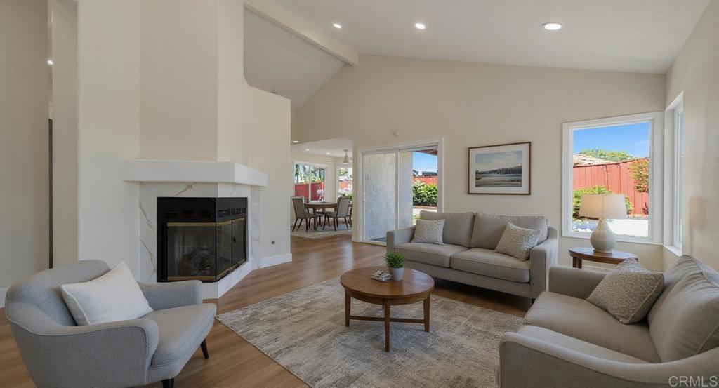 Completely updated single-story home located at 718 Lockwood Place in the heart of Oceanside. This residence has been fully renovated to combine modern function with coastal style, offering a thoughtful blend of comfort, efficiency, and quality finishes throughout. The interior features brand-new luxury vinyl plank flooring, recessed lighting, and dual-pane windows that improve both energy efficiency and sound reduction. Fresh interior and exterior paint create a bright and welcoming environment. The kitchen has been fully remodeled with sleek quartz countertops, a custom backsplash, updated cabinetry, and modern fixtures. The primary suite includes a walk-in closet and a remodeled bathroom with a spa-style shower. The secondary bathroom has been updated with custom tilework and an overhead rain-style showerhead. Additional upgrades throughout the home include elegant matte gold finishes, new ceiling fans, and modern hardware. The exterior is designed for both relaxation and entertaining. The spacious backyard features a newly restored water fountain, creating a tranquil outdoor setting. A new stucco wall provides additional privacy and enhances the home’s curb appeal. The three-car garage includes epoxy flooring, offering generous storage and workspace for vehicles, hobbies, or projects. This property is move-in ready and offers a rare combination of upgrades and value. No HOA fees and no Mello-Roos. Conveniently located near schools, parks, shopping, dining, and Oceanside’s beaches, this home is a standout opportunity in today’s market.